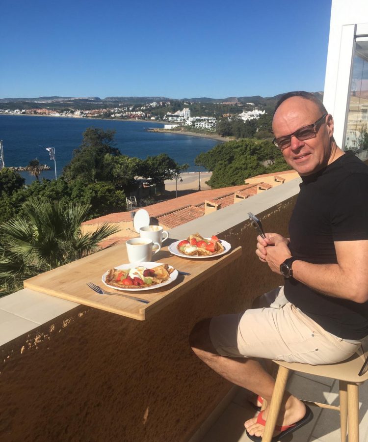 John having breakfast on his balcony in estepona